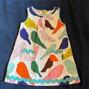 Mini Boden corduroy dress with a colorful bird pattern
